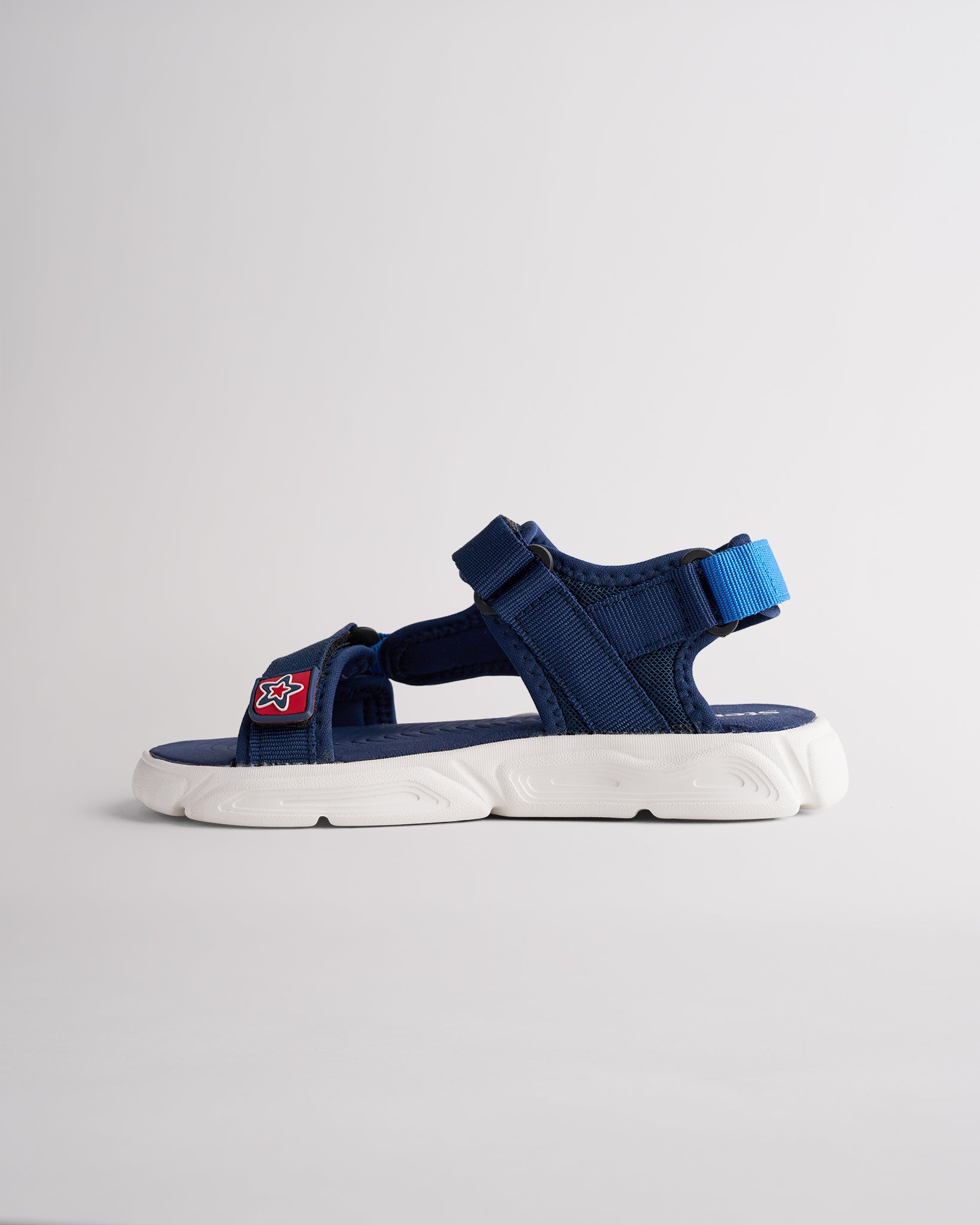 Kids sport sandals with hook-and-loop straps and durable grippy outsole
