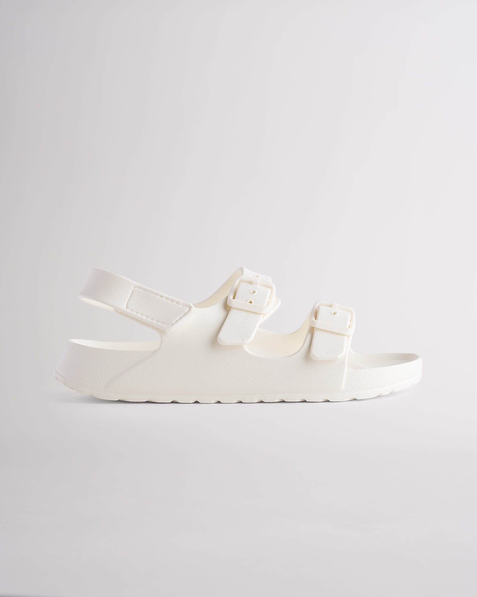 Creme kids sandals with adjustable buckles, heel strap, and lightweight EVA sole for everyday comfort