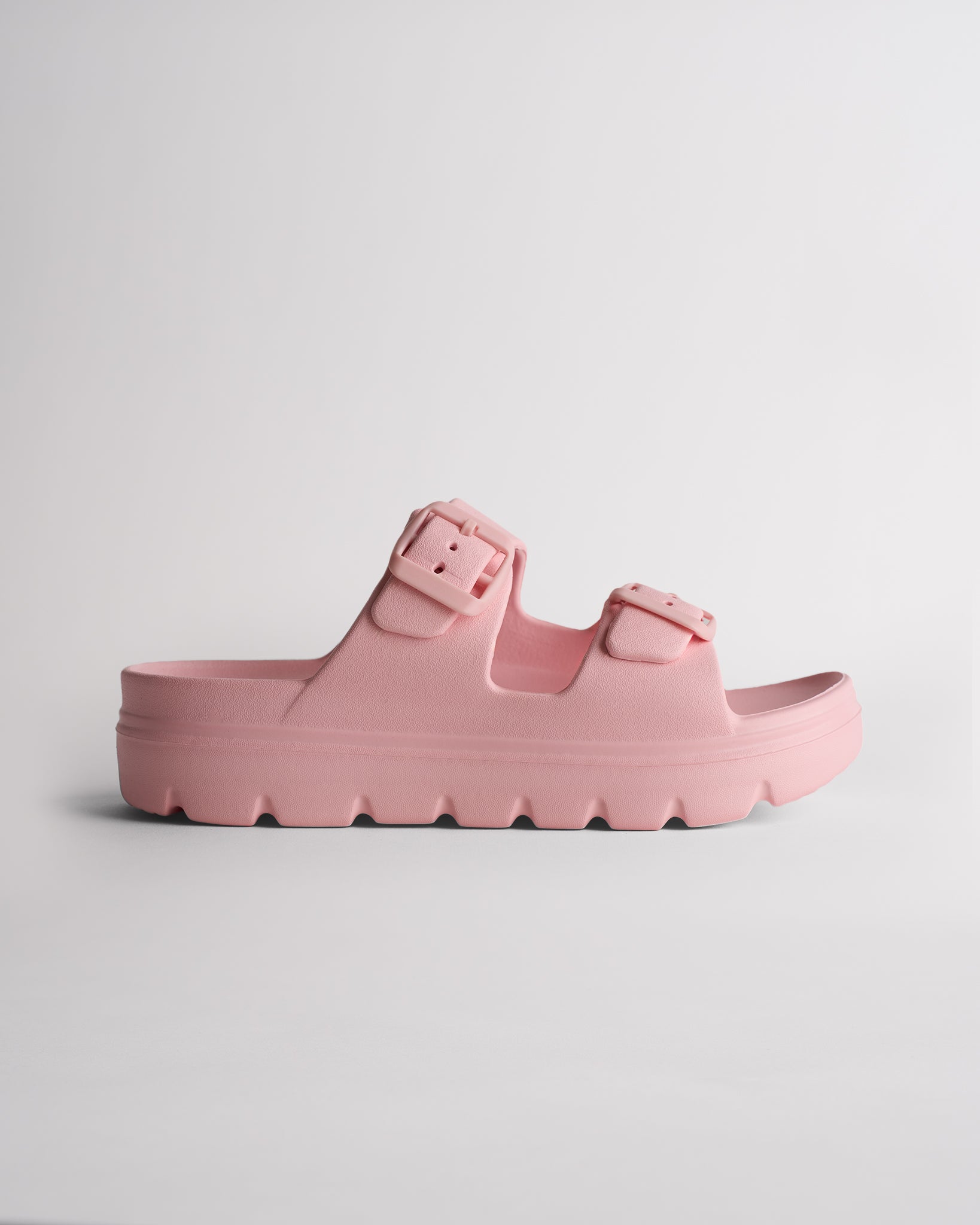 Pink Stelle Kids StelleCloud Buckled Slide with adjustable buckle straps, contoured footbed, and supportive casual design.