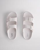 Top view of white Stelle Kids StelleCloud Buckled Slide with two buckle straps, contoured footbed, and Stelle logo detail.