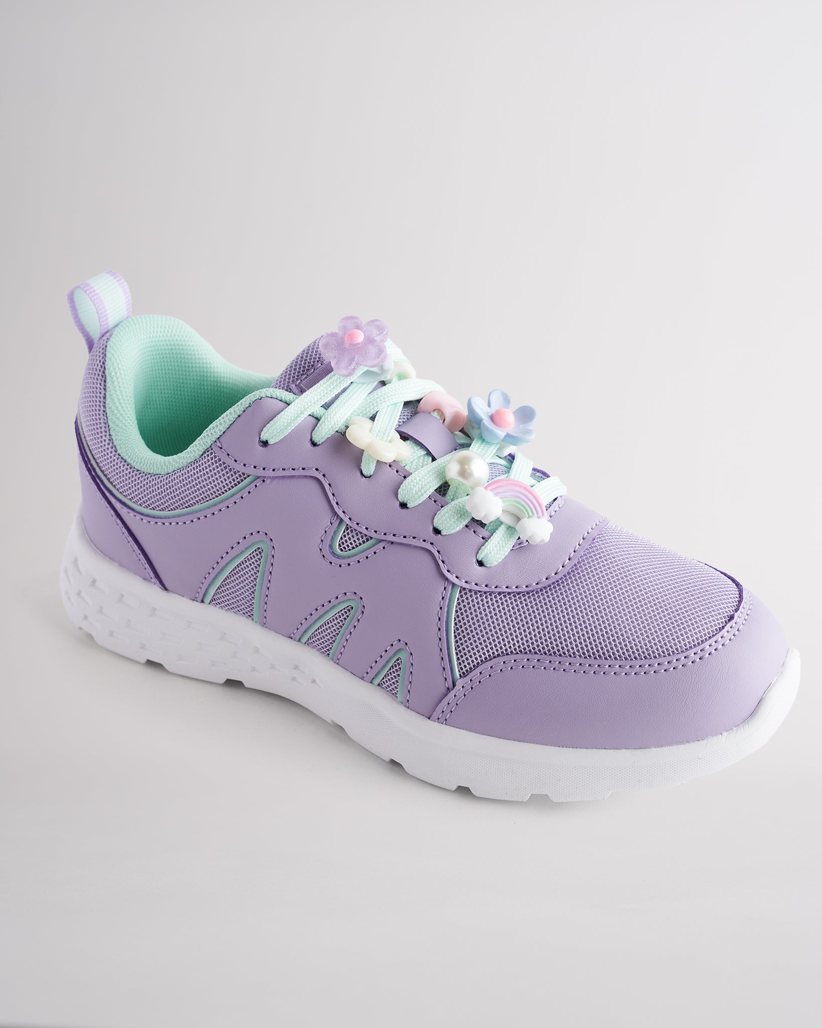 Lavender lightweight kids’ sneakers with breathable mesh uppers, a cushioned insole, and a durable outsole.