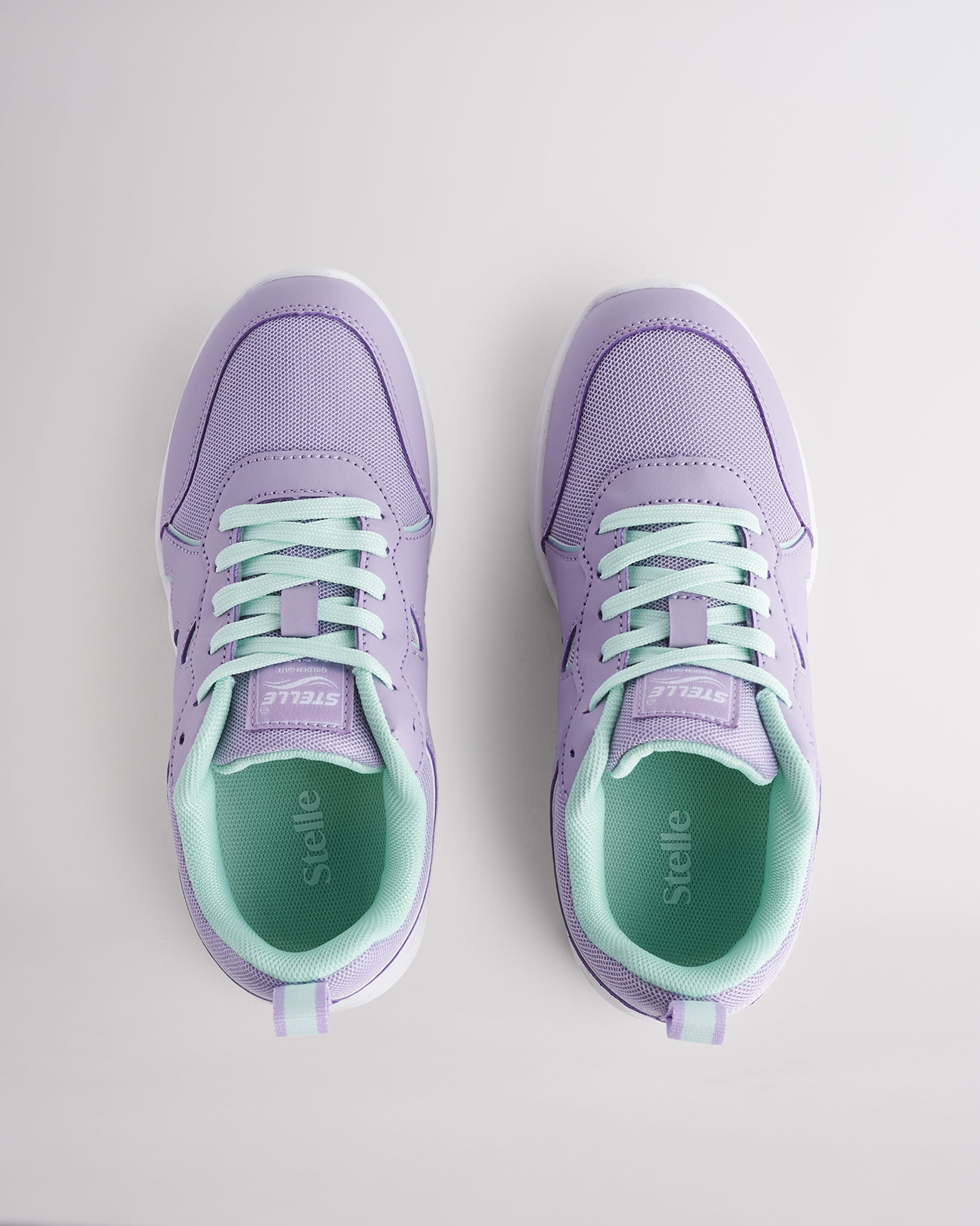 Lavender lightweight kids’ sneakers with breathable mesh uppers, a cushioned insole, and a durable outsole.