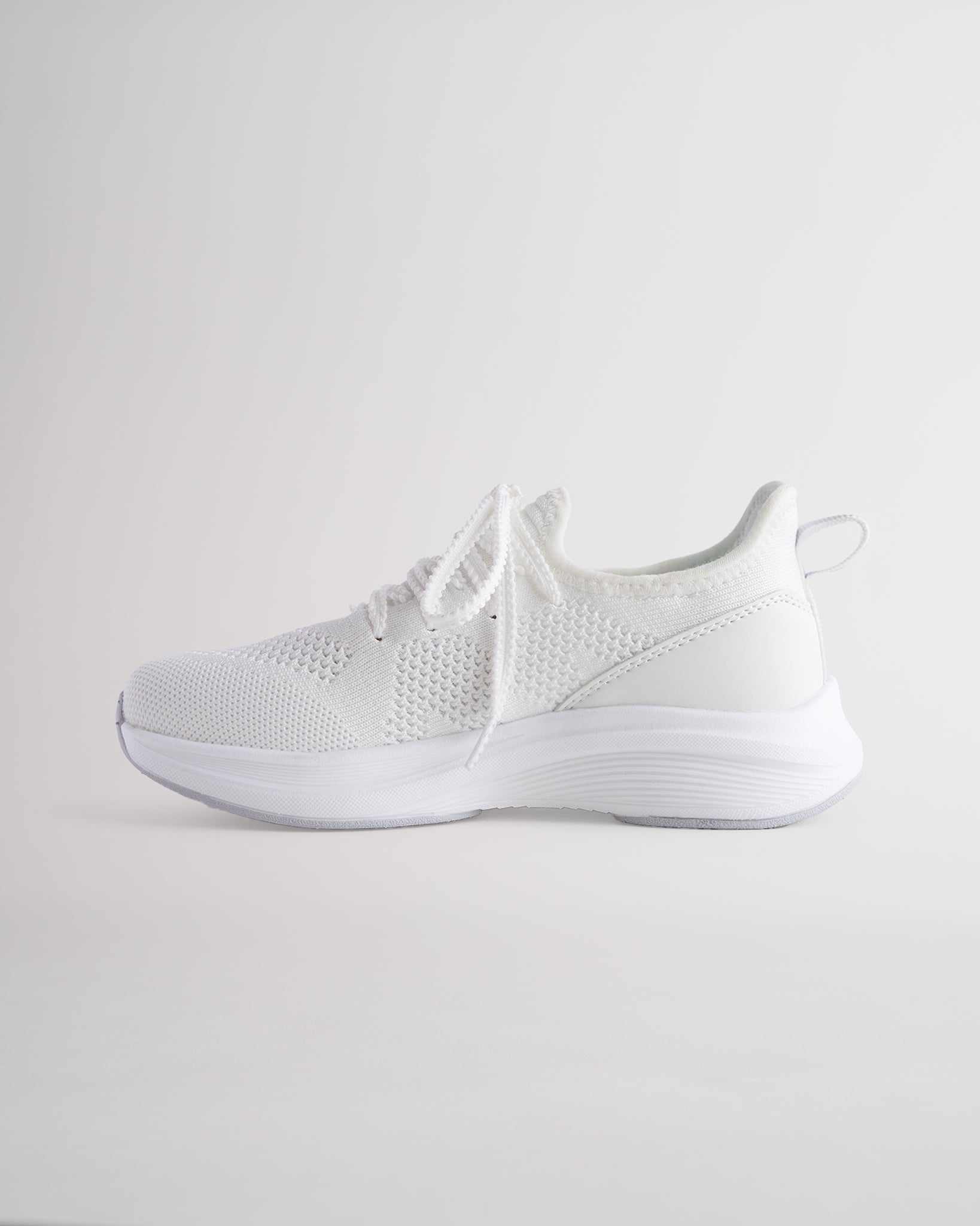 Kids White lace-up running sneakers with cushioned white sole