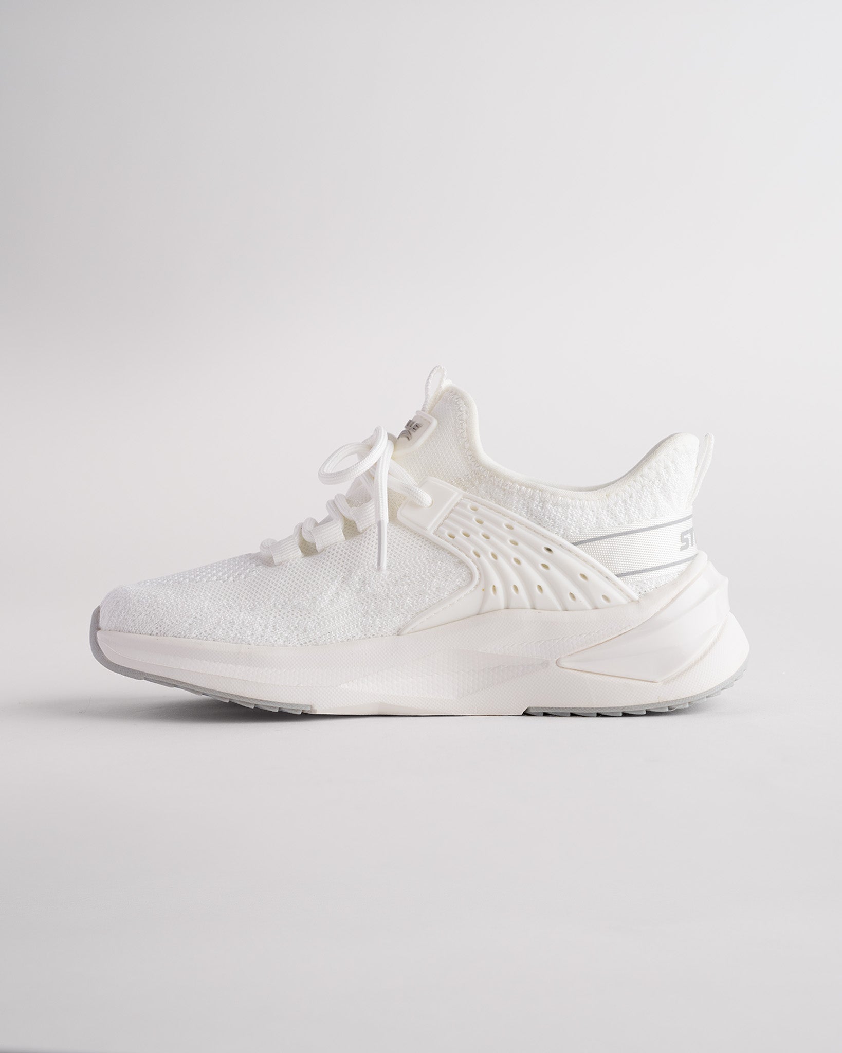 kids running shoes in white