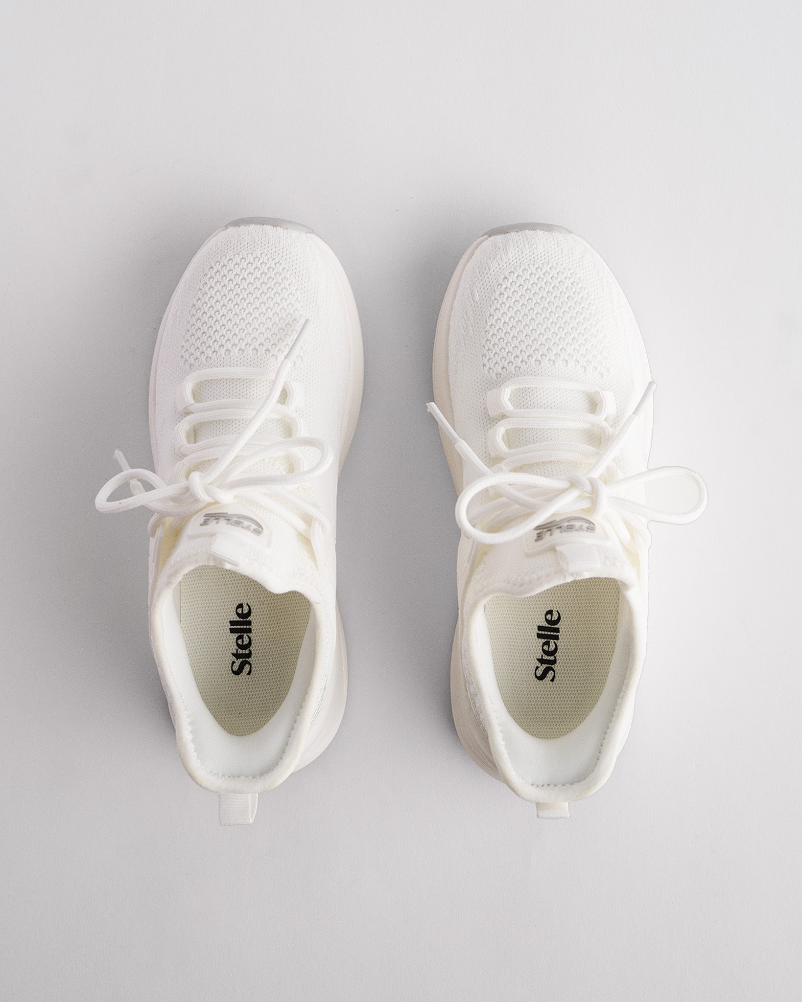kids running shoes in white