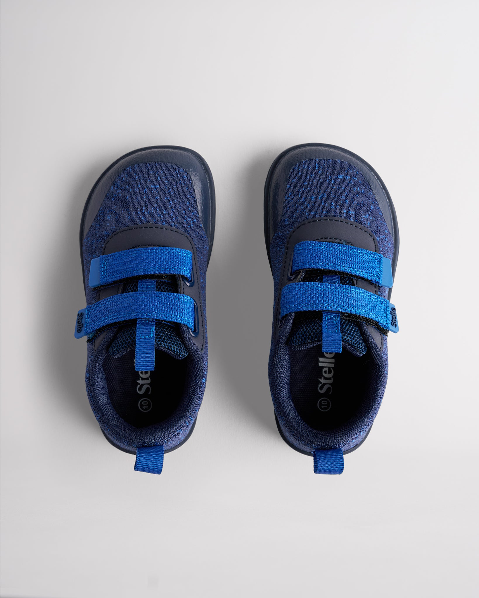Top view of navy kids barefoot shoes showing dual straps and breathable interior