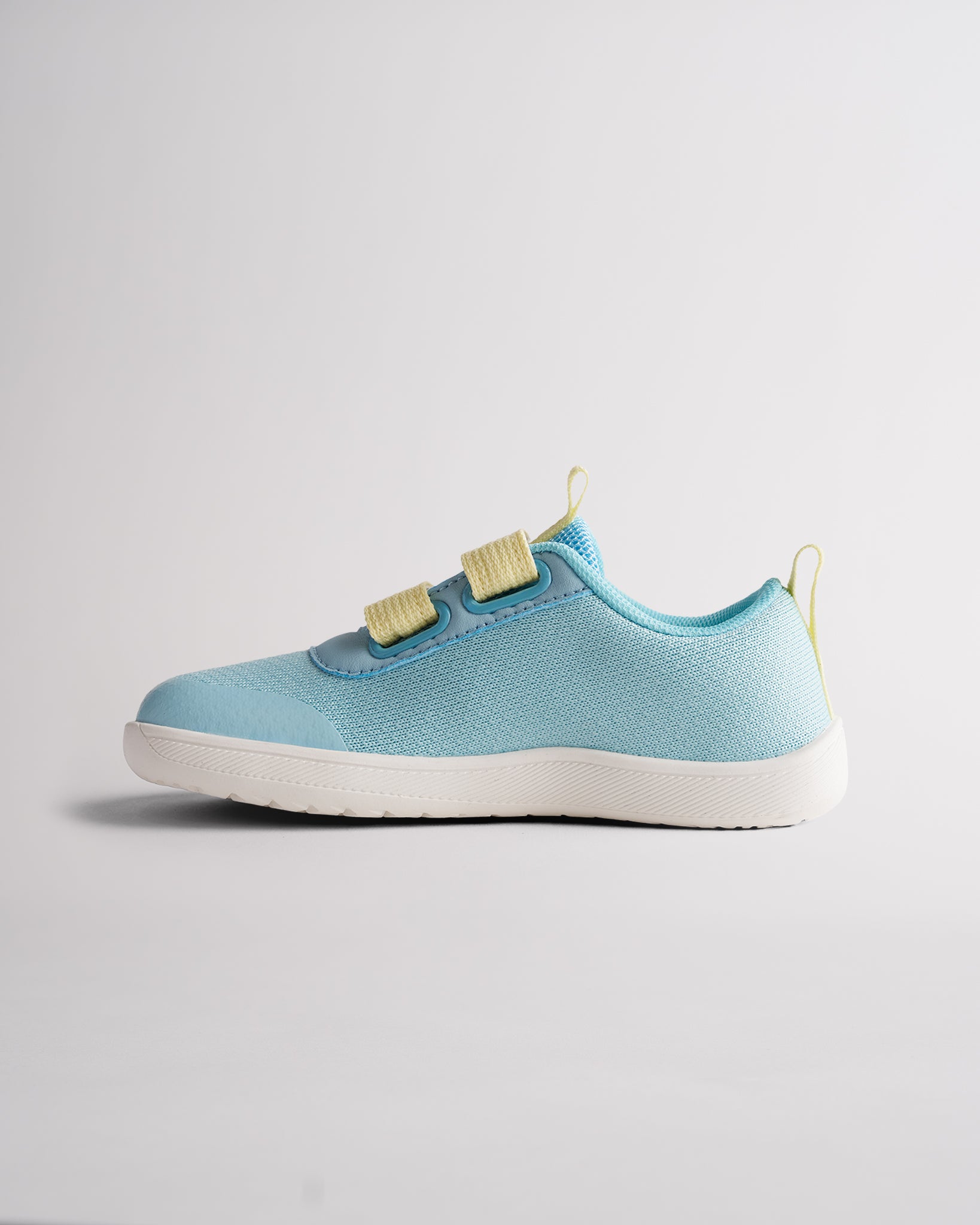 Lightweight kids barefoot shoes with adjustable hook-and-loop straps and flexible sole