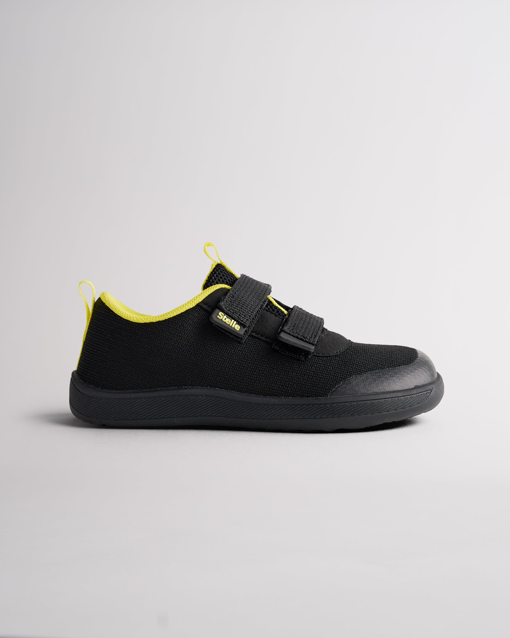 Black kids barefoot shoes with dual straps and wide toe box for natural movement