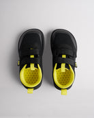 Top view of black kids barefoot shoes showing dual straps and breathable interior
