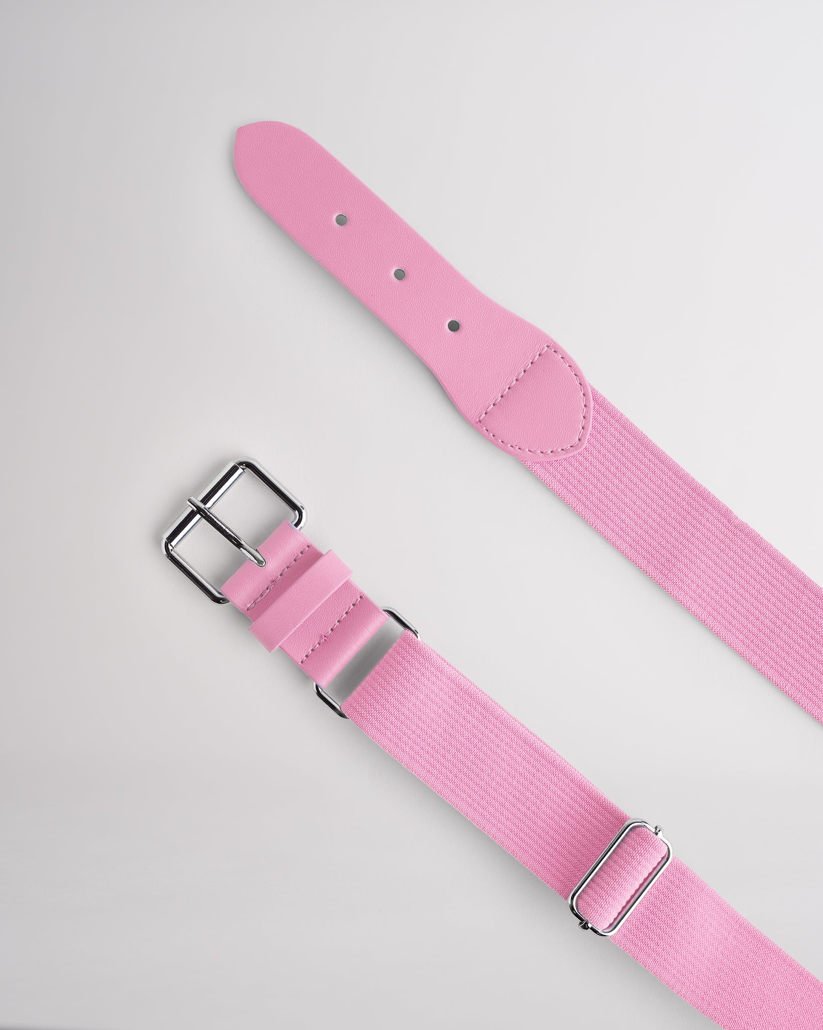 Kids petal pink elastic softball belt with silver buckle.