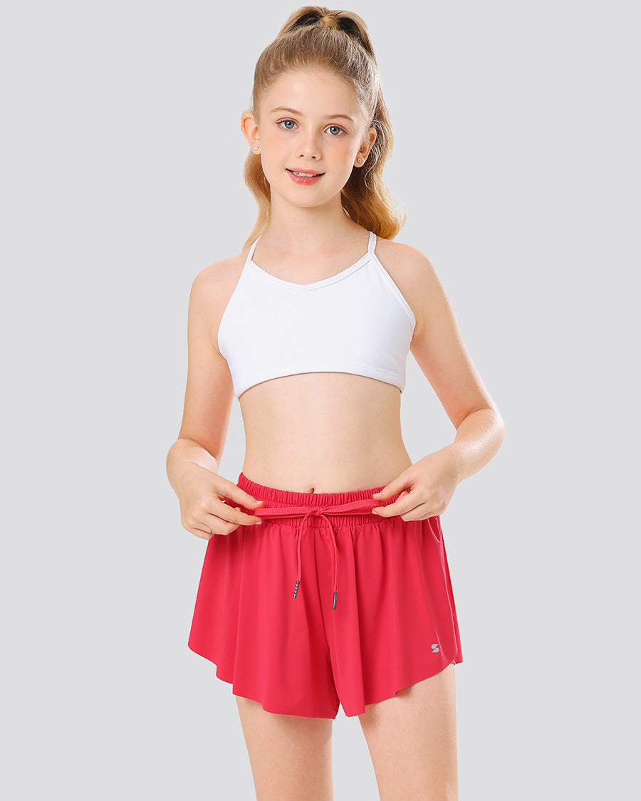 Girl wearing raspberry butterfly shorts