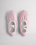 Kids glitter ballet shoes in dusty pink glitter with crisscross elastic straps, top view