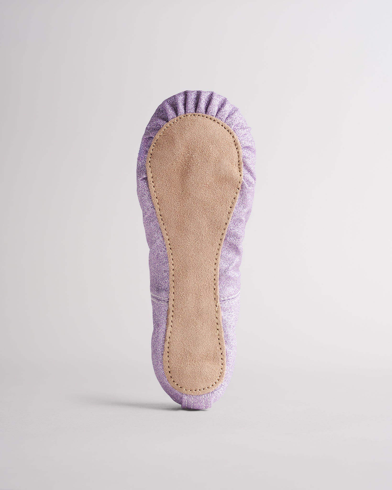 Kids purple glitter ballet shoes with suede sole, bottom view