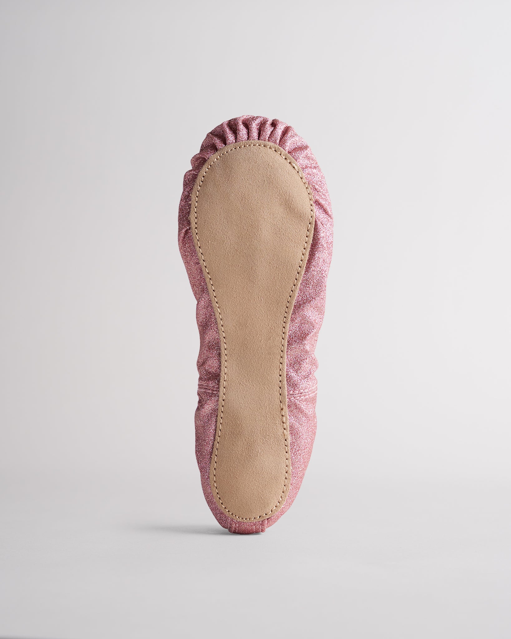 Kids rose glitter ballet shoes with suede sole, bottom view