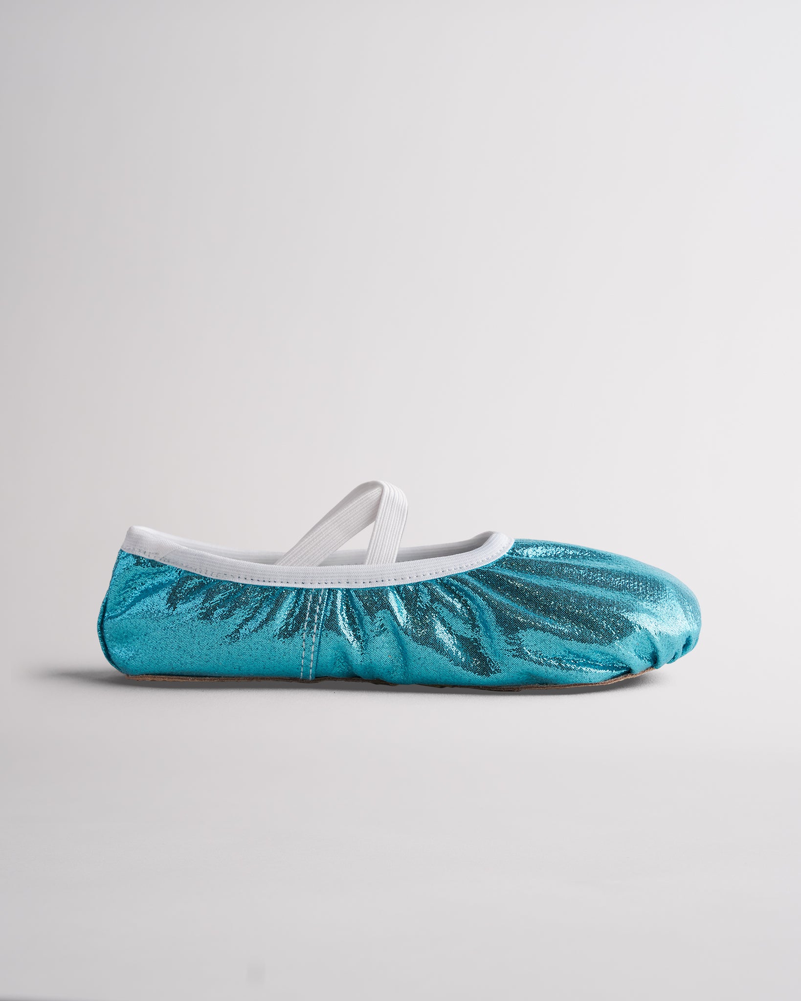 Metallic blue ballet shoes with elastic cross straps and flexible sole for dance class