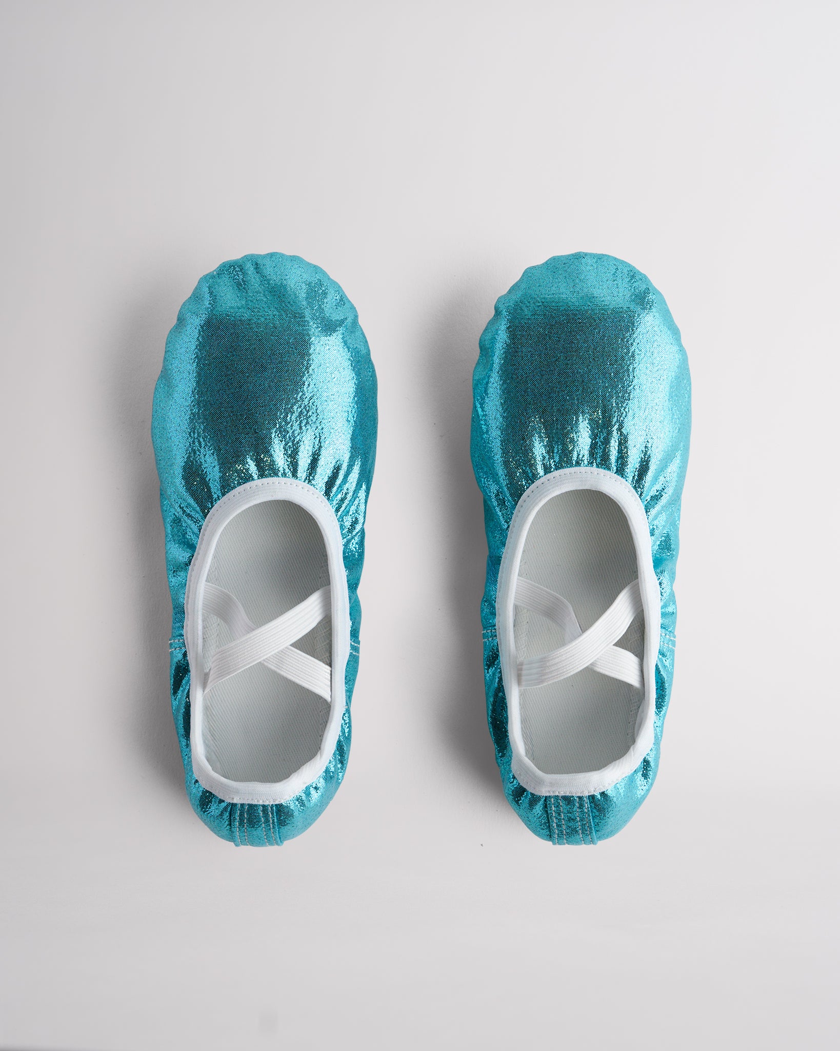 Top view of metallic shimmer ballet shoes with elastic straps for secure fit and performance