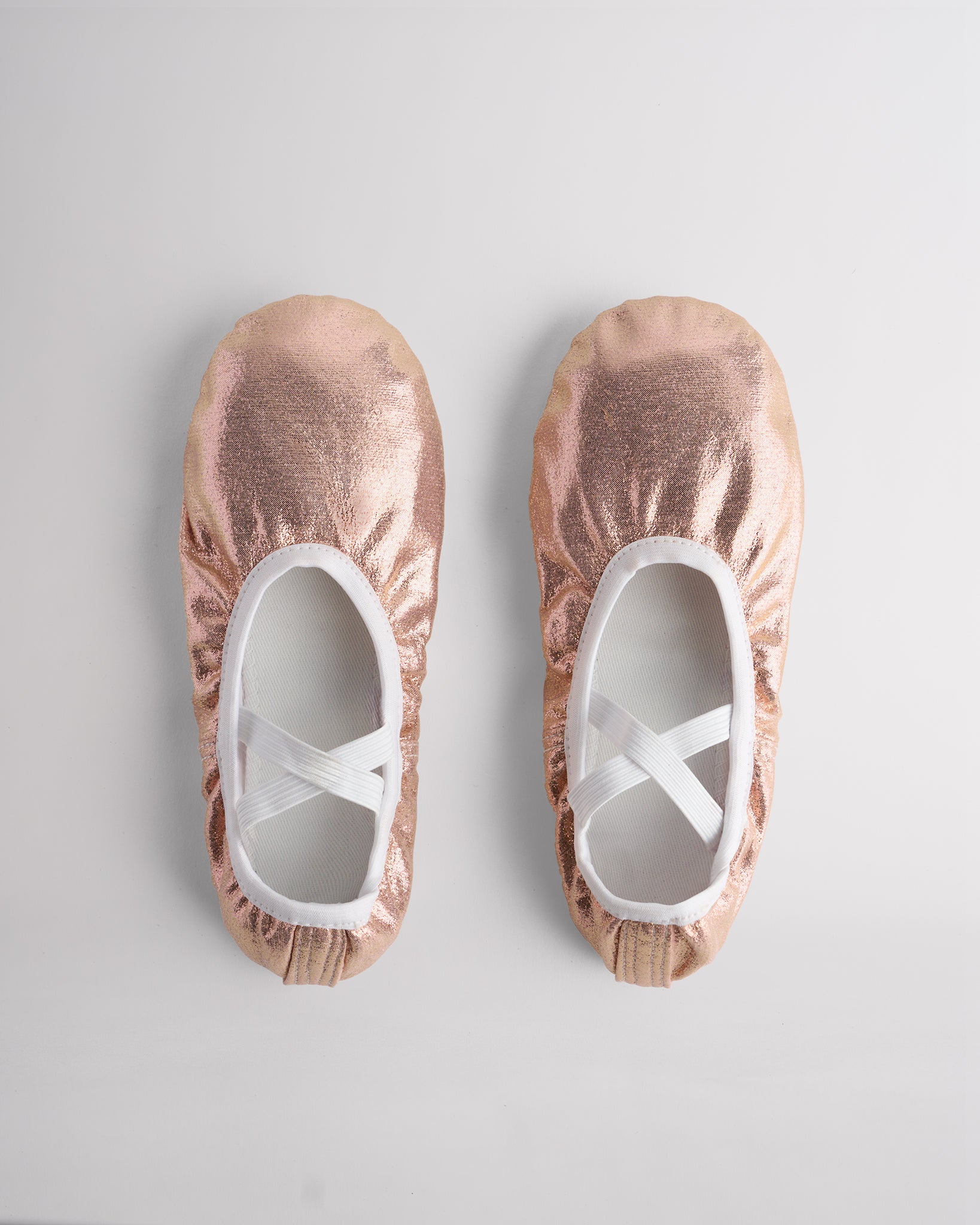 Top view of metallic shimmer ballet shoes with elastic straps for secure fit and performance