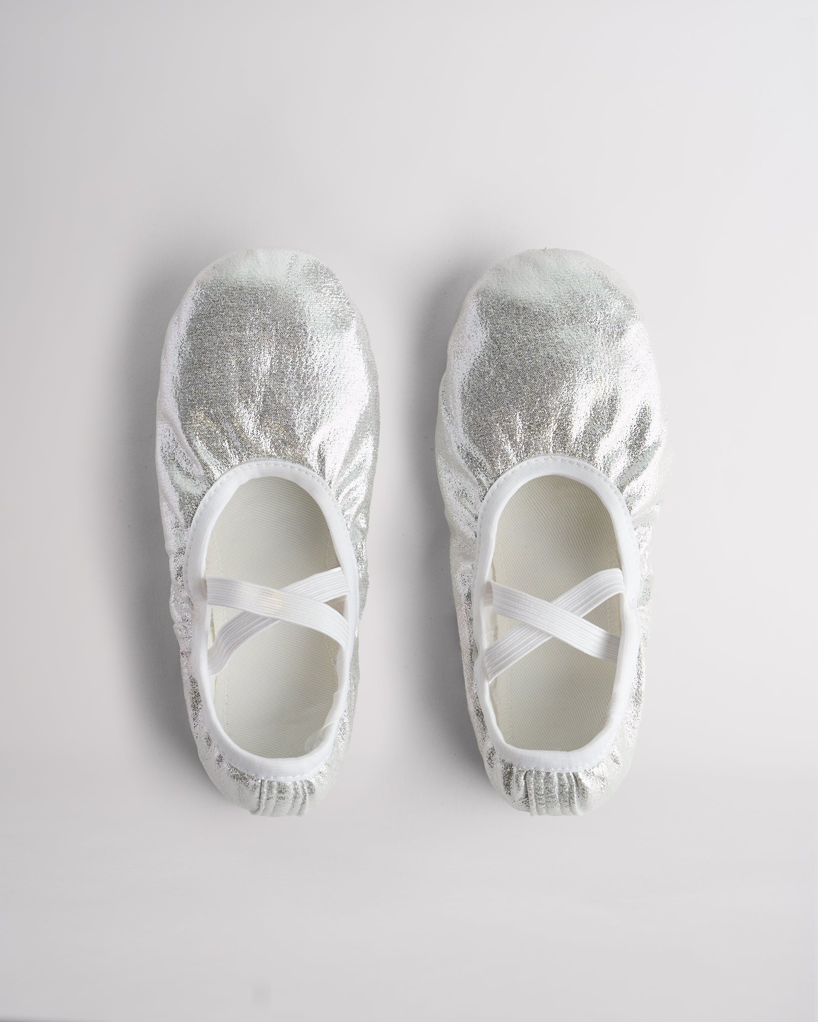 Top view of metallic shimmer ballet shoes with elastic straps for secure fit and performance