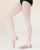 Light pink tights worn by a person on a plain background