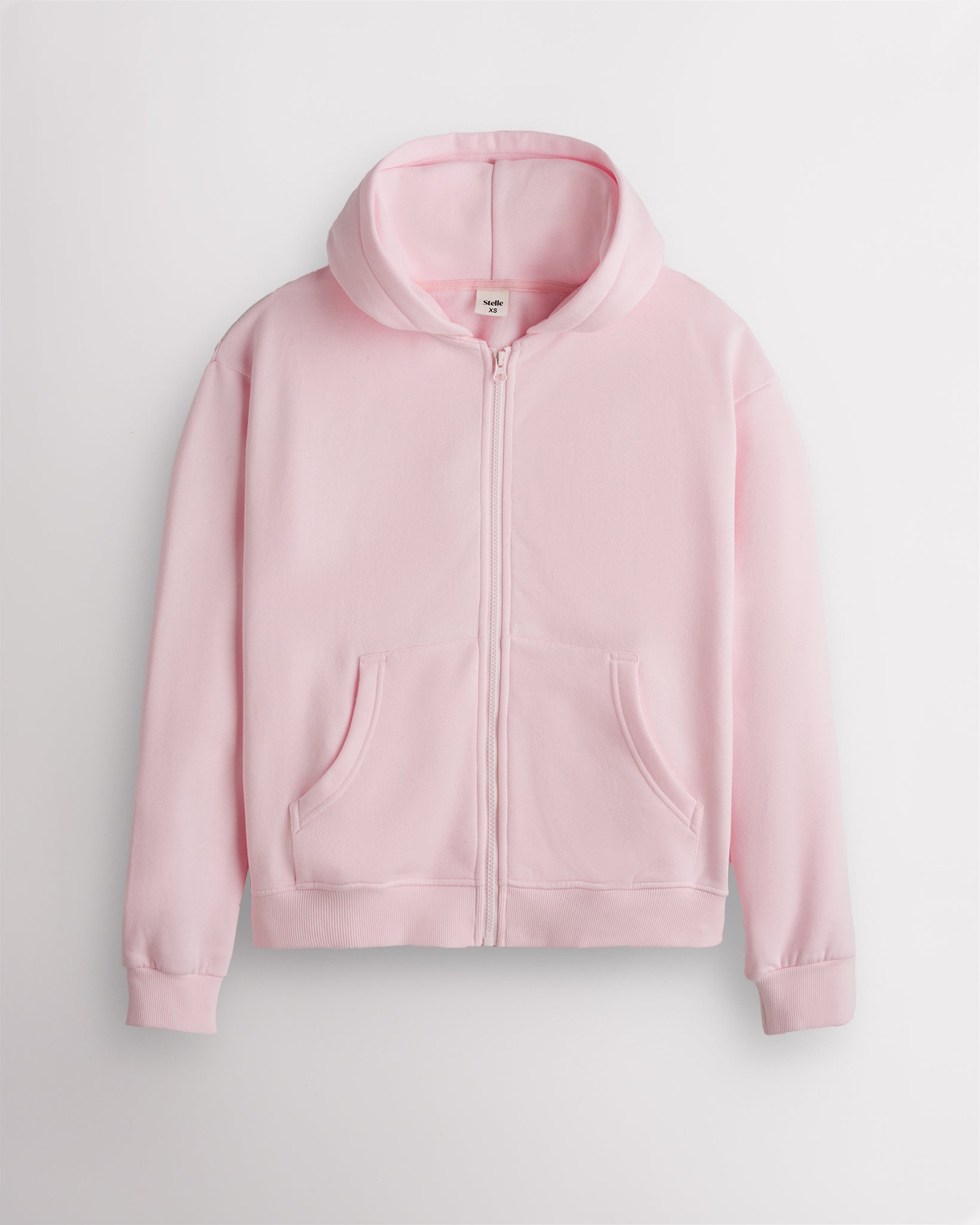 Soft pink Stelle women's fleece-lined zip-up hoodie shown flat, front view with the zip closed.