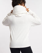 Back view of white UV-protective jacket with mesh paneling and extended sun-protection collar.
