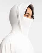 Close-up of UV-protective jacket hood with built-in mesh face cover and wide brim for sun protection.