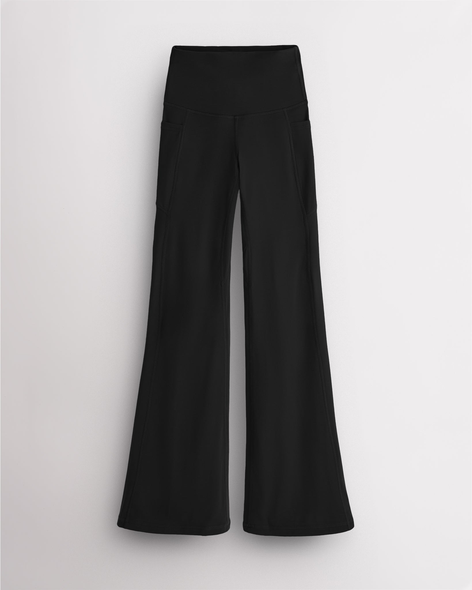 Black Stelle womens flare leggings with pockets, high waistband, and flared leg design on white background