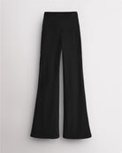 Black Stelle womens flare leggings with pockets, high waistband, and flared leg design on white background