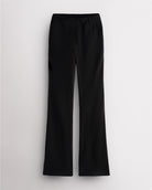 Black Stelle mid-rise bootcut womens work pants with pull-on waistband, faux fly, front pockets, and leg-lengthening bootcut silhouette.