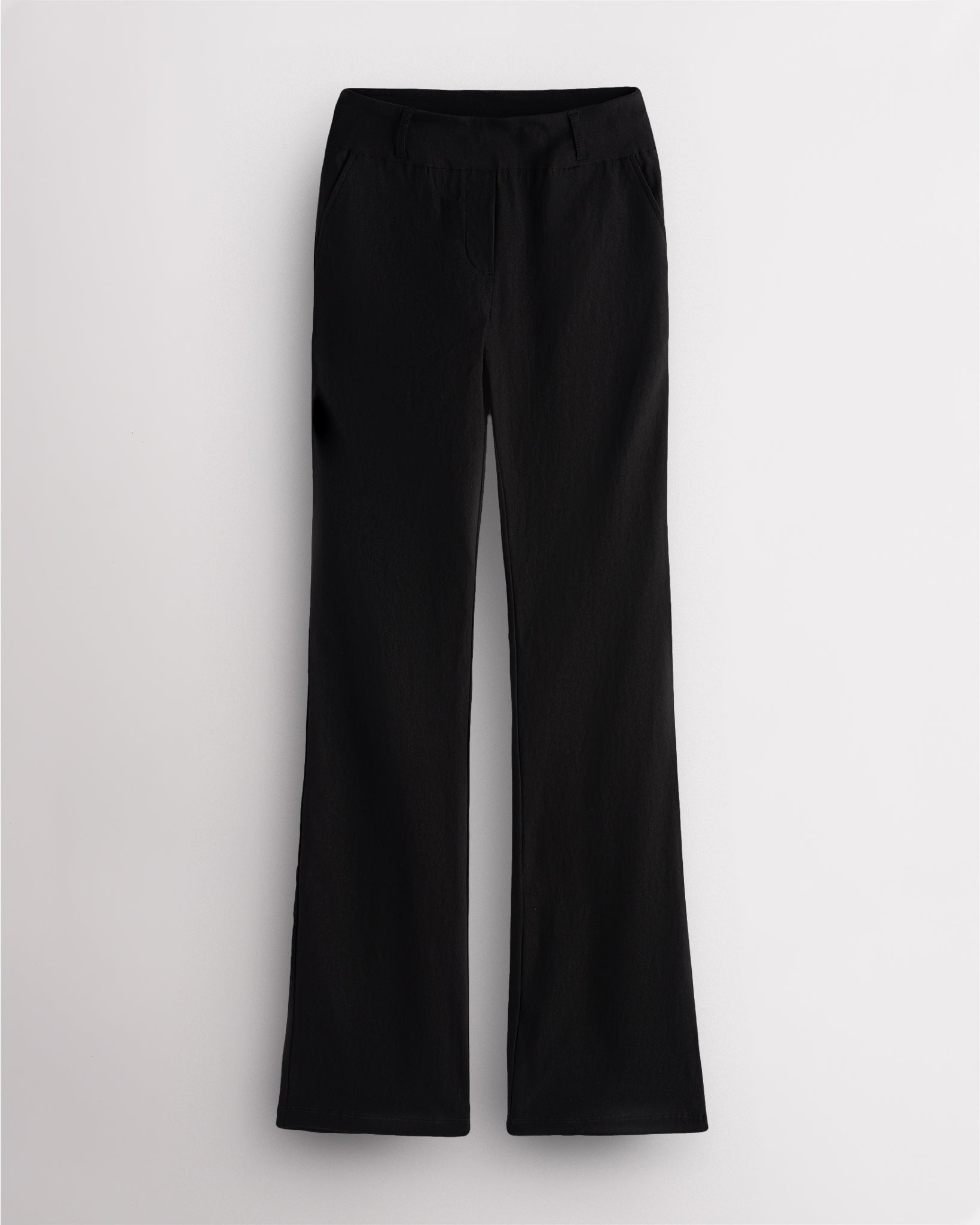 Black Stelle mid-rise bootcut womens work pants with pull-on waistband, faux fly, front pockets, and leg-lengthening bootcut silhouette.
