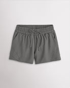 Women’s smoke grey high-rise running shorts with a wide elastic waistband, drawstring tie, side pockets, and double-layer hem.