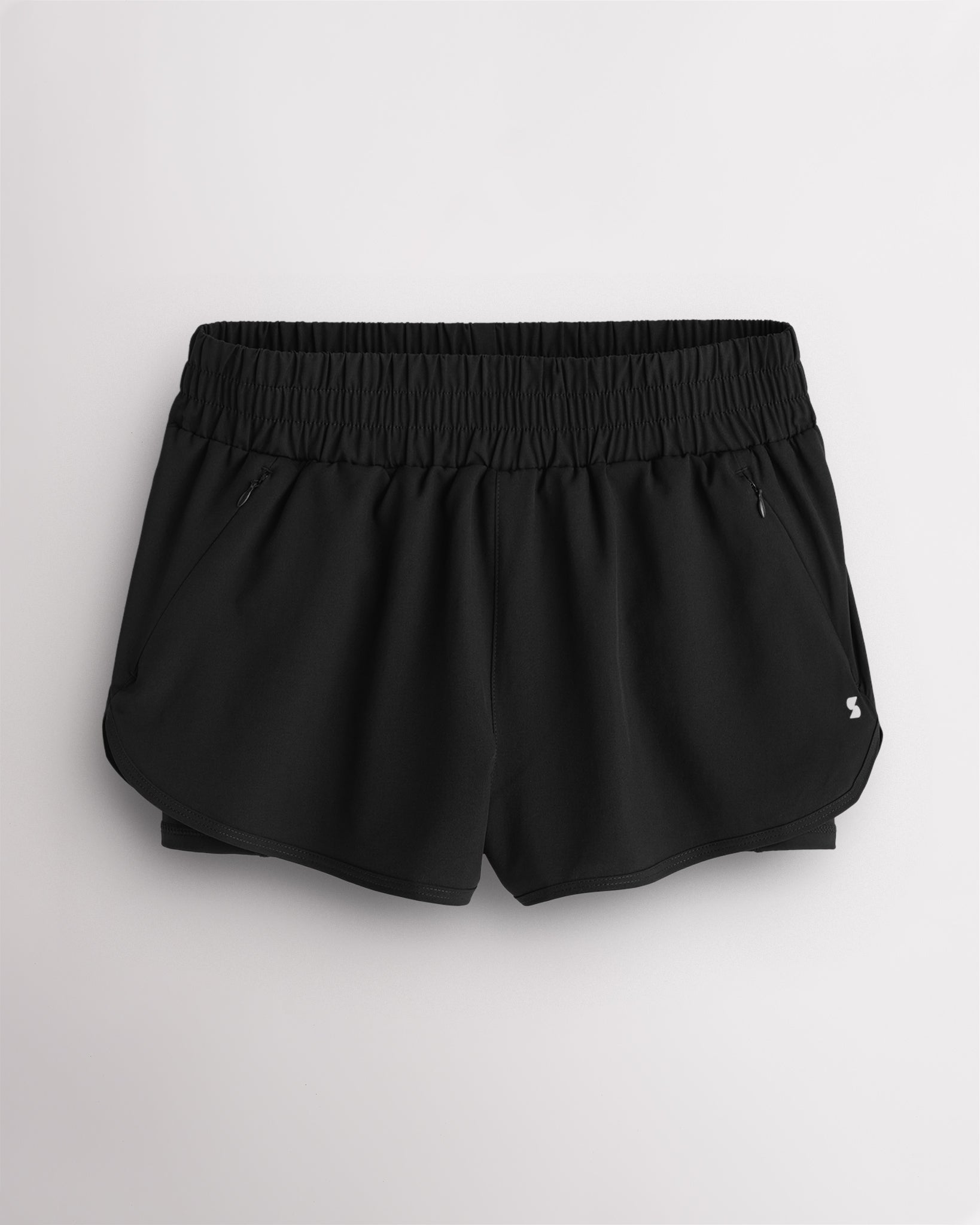 Grey Stelle RushMode 2-in-1 running shorts with wide elastic waistband, zipper pockets, inner shorts lining, and curved dolphin hem.