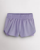 Purple Haze Stelle RushMode 2-in-1 running shorts with wide elastic waistband, zipper pockets, inner shorts lining, and curved dolphin hem.
