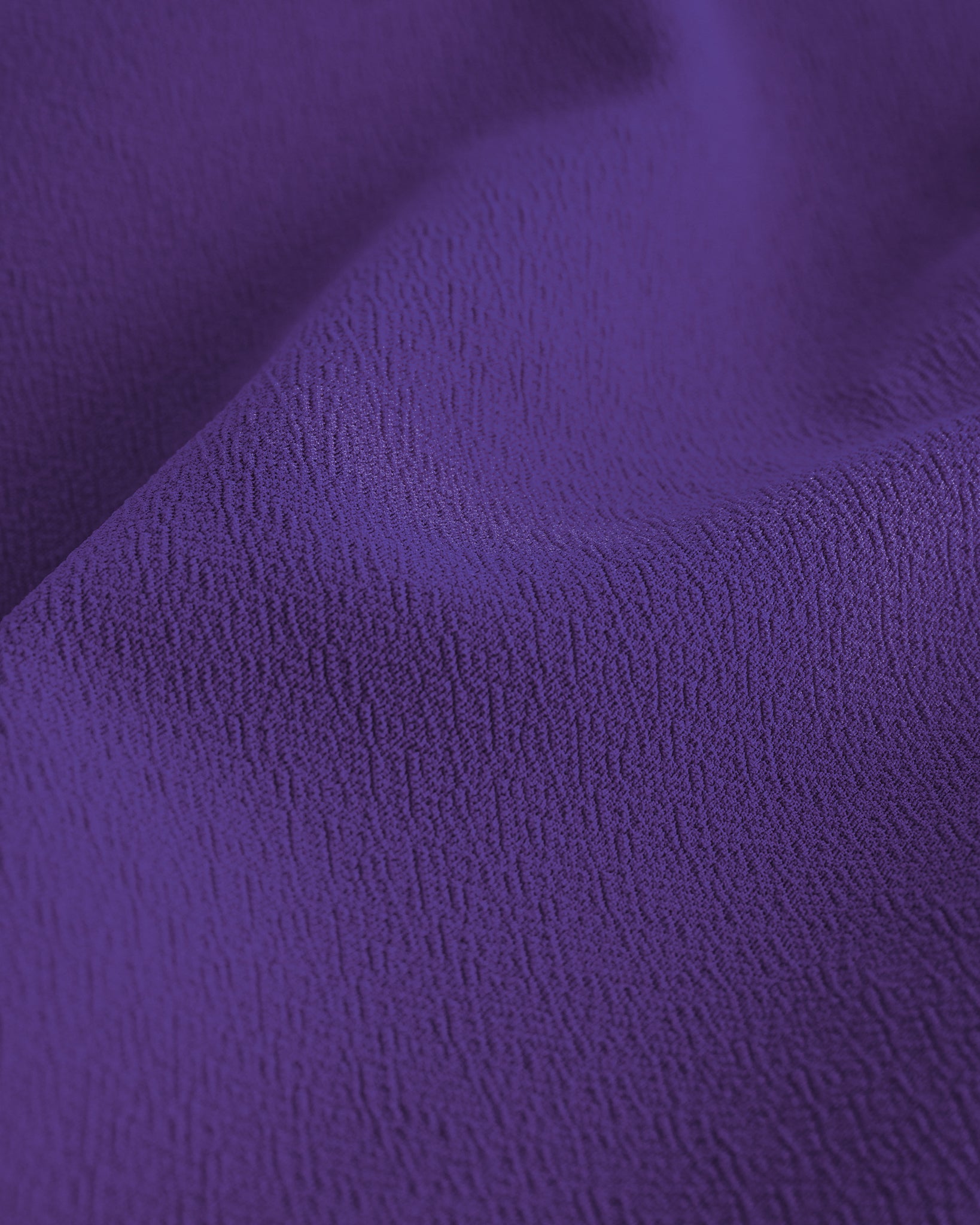 Close-up of purple Stelle stretchy flared skater skort showing softly textured fabric detail.