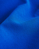Close-up of Cobalt blue textured fabric from a flared skater casual skort.