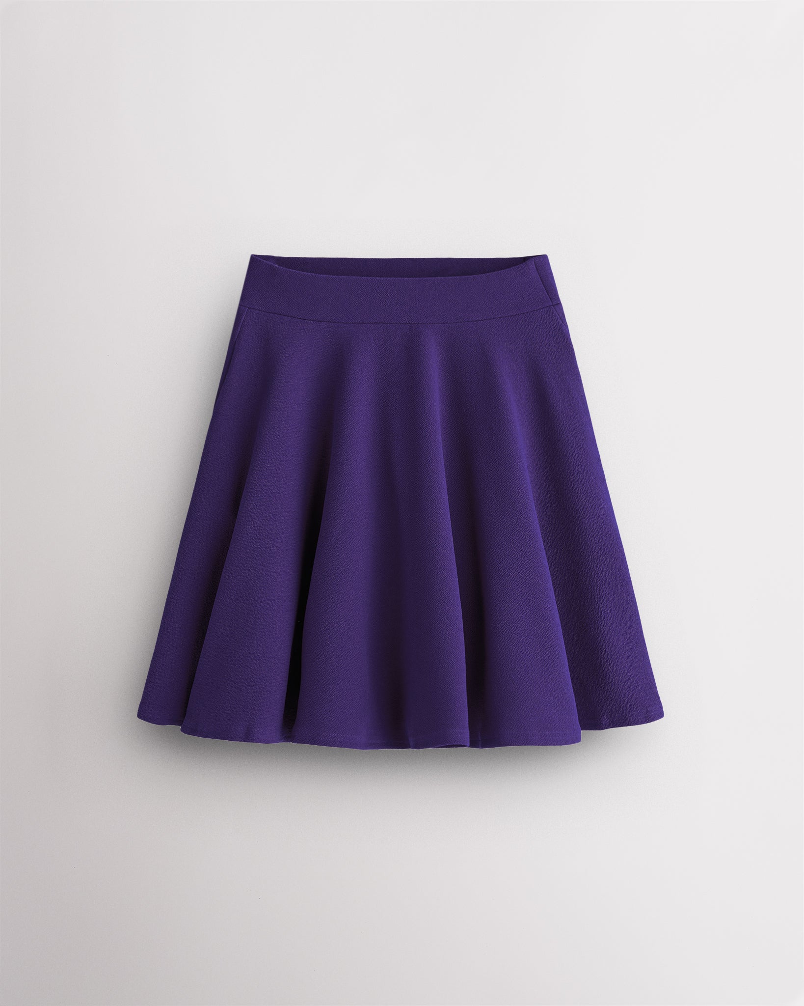 Purple Stelle womens knee-length flared midi skirt with high waistband, A-line silhouette, and flowy pleated design.