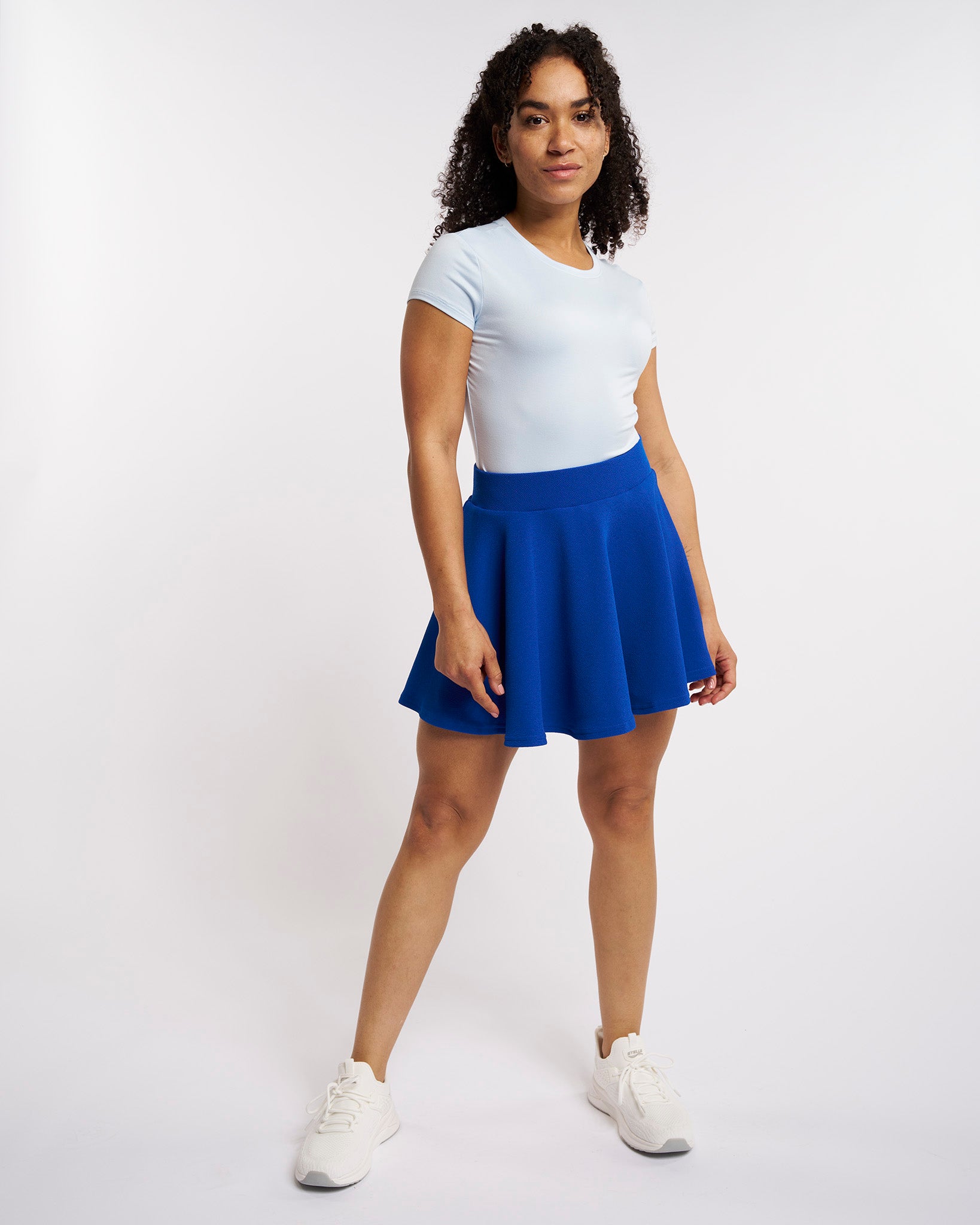 Cobalt blue flared skater casual skort worn by a woman.