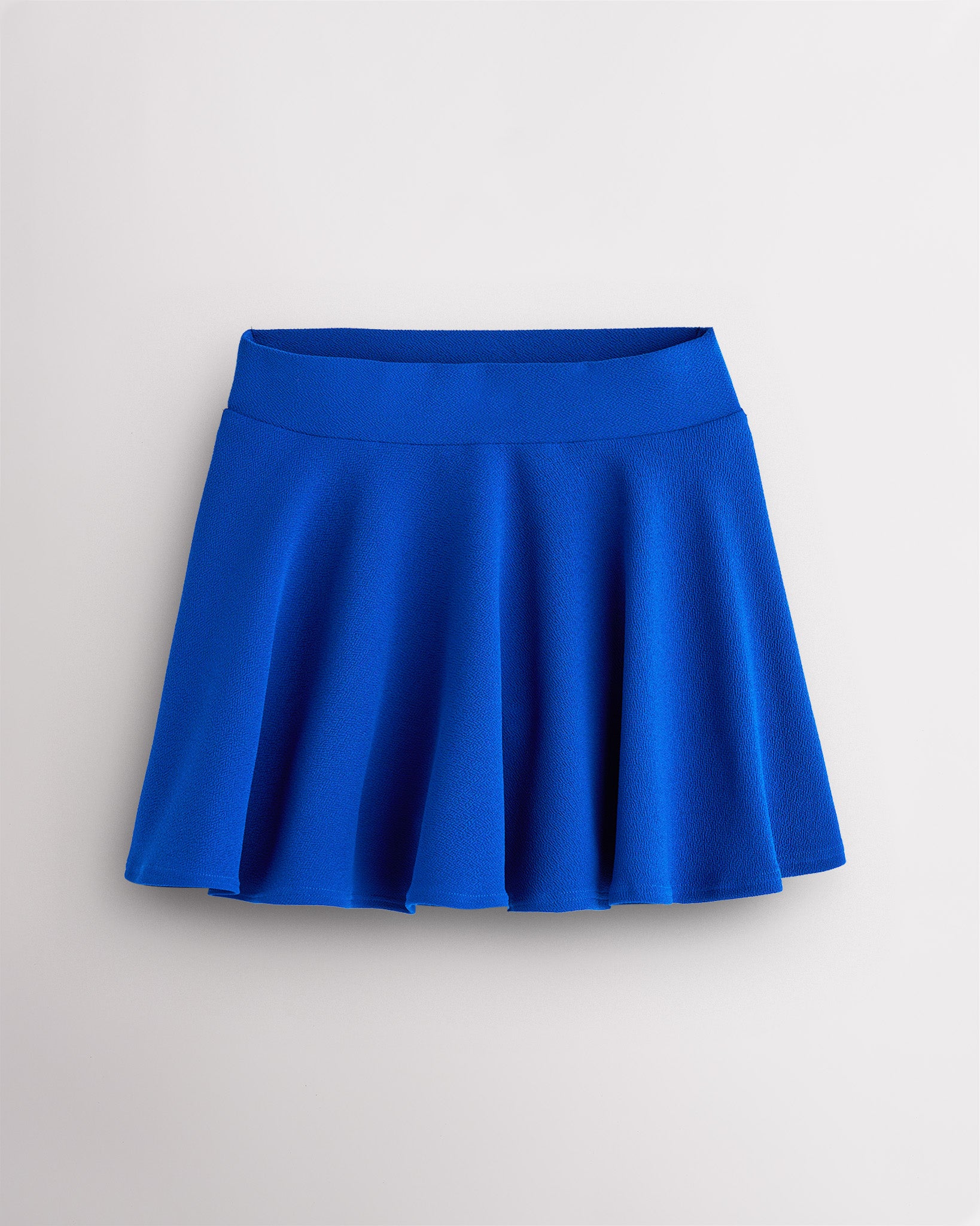Cobalt blue flared skater casual skort with a wide waistband.