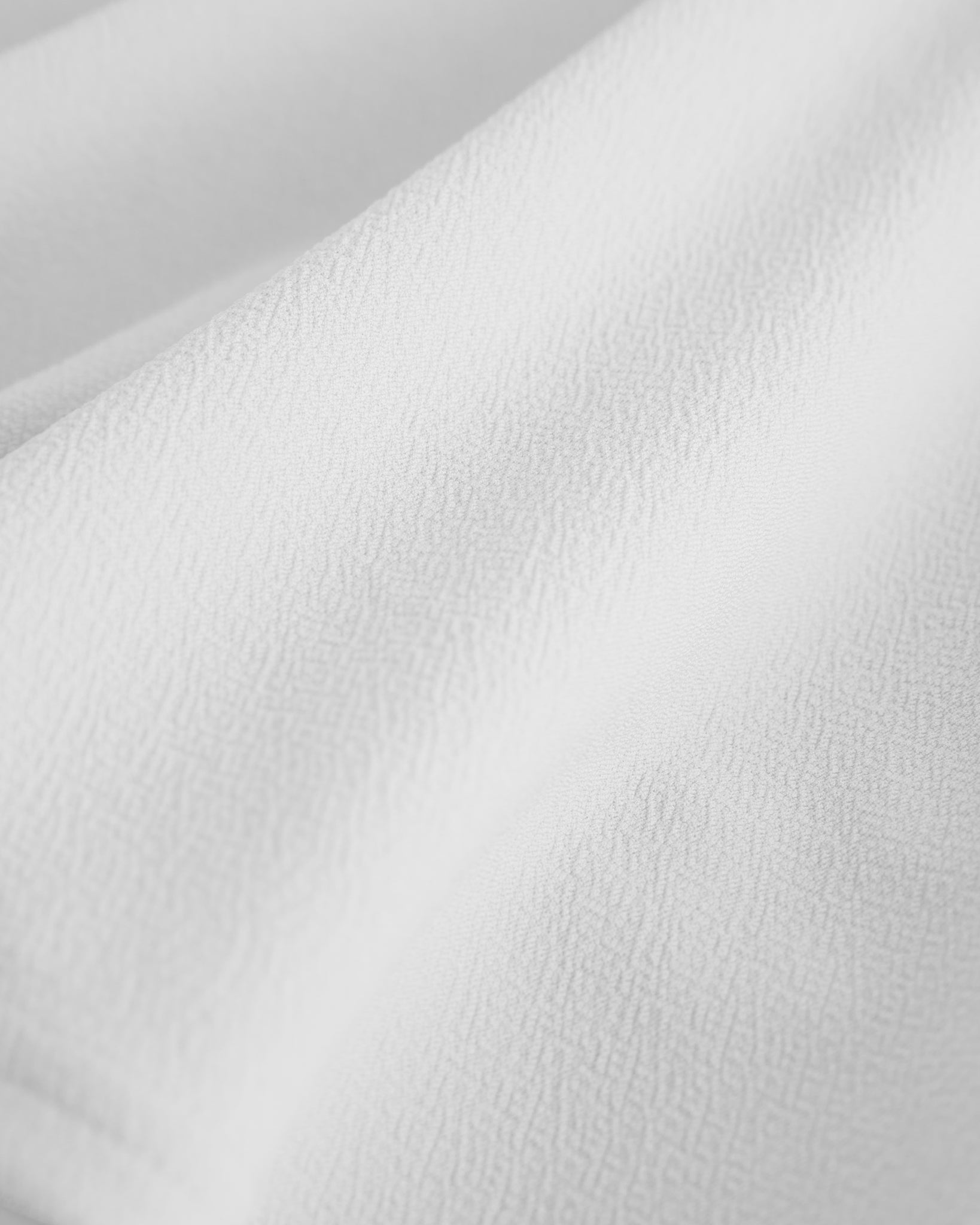 Close-up of a white flared skater skort with built-in black shorts.