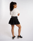 Back view of flowy layered tennis skort with flattering silhouette and lightweight fabric