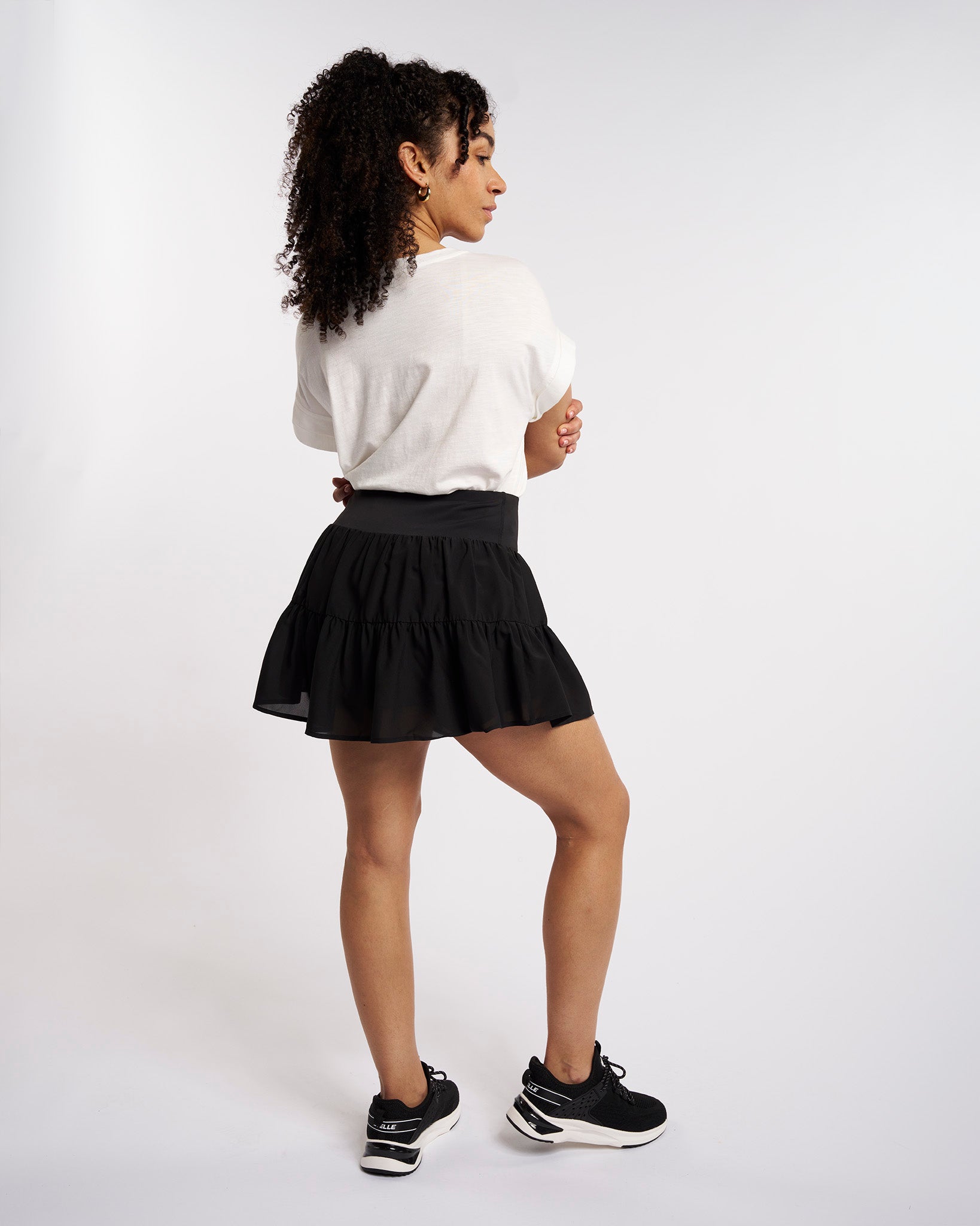 Back view of flowy layered tennis skort with flattering silhouette and lightweight fabric