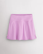 Lilac Stelle classic tennis skirt with a high-waisted fit, slightly flared silhouette, side slits, and bow ribbon details.