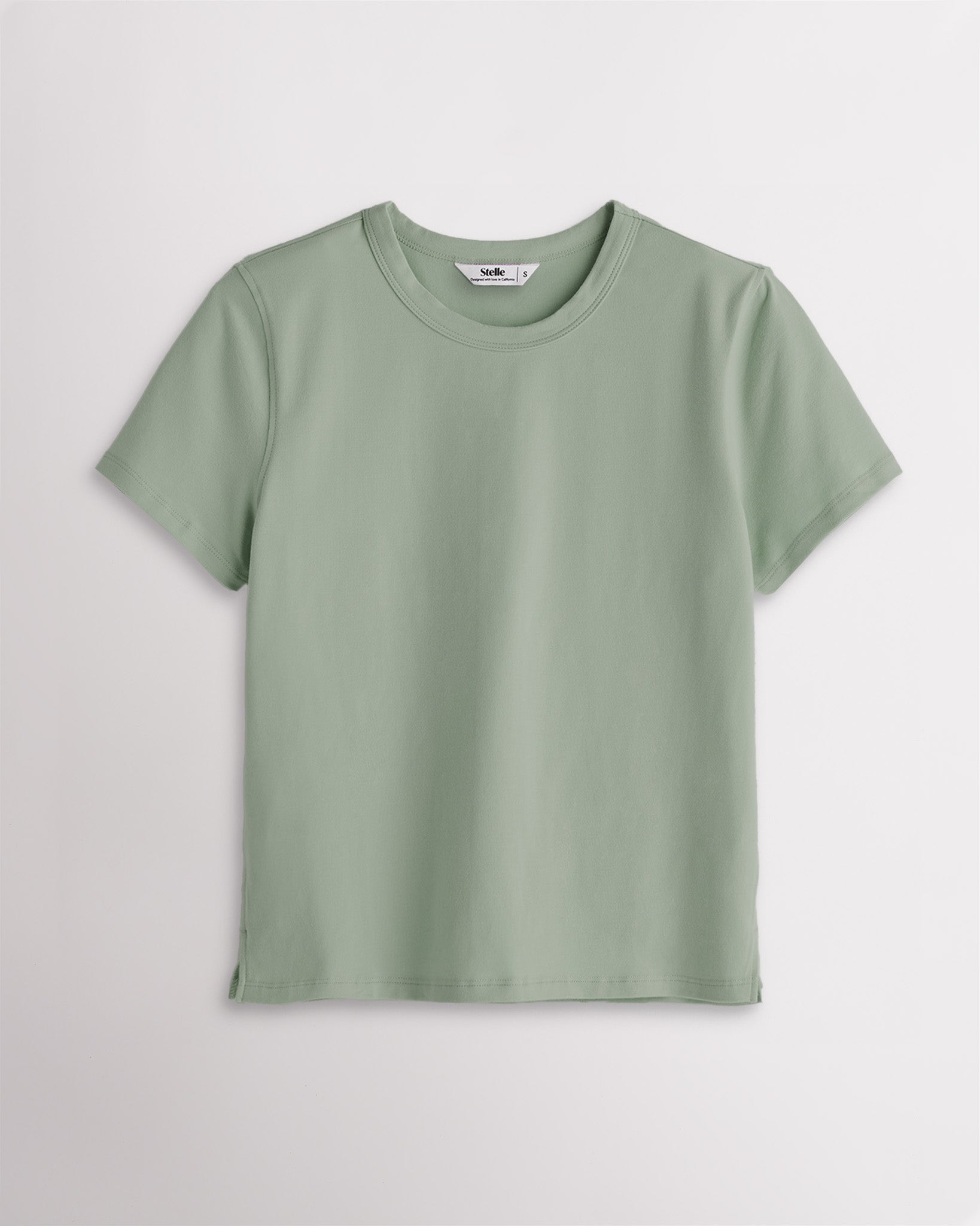 Grey Sage Stelle womens short sleeve basic t shirt with crewneck, relaxed boxy fit, and side slits on white background