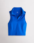 Women’s sapphire fitted cropped polo tank top with a V-neckline, classic collar, sleeveless cut, and contoured seam detailing.