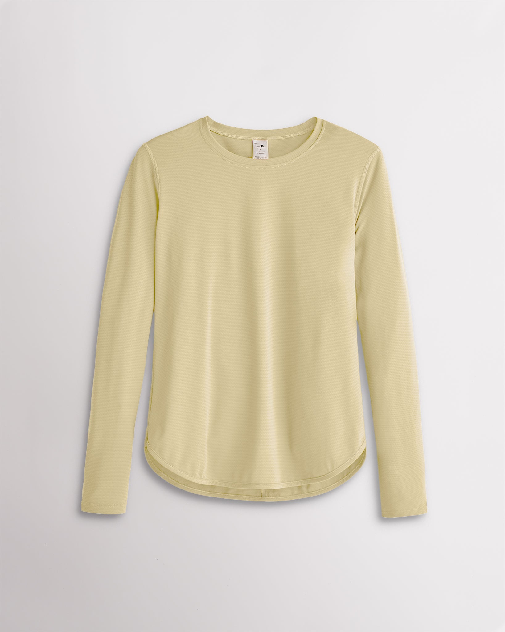 Women’s butter UPF 50+ long sleeve sun protection shirt with curved hem and lightweight breathable fabric.