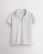 White womens V-neck athletic polo shirt with classic collar, slim fit and side slit hem for active wear