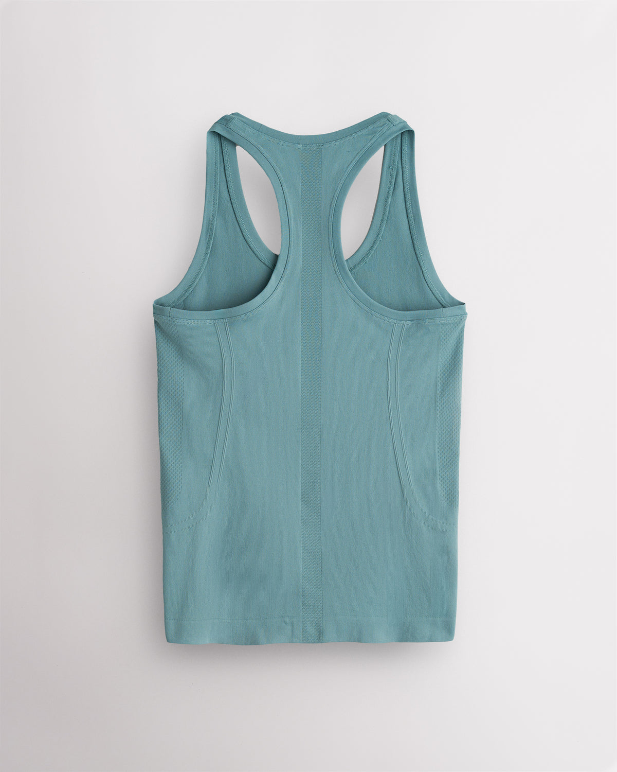 Back view of the Blue Sage Stelle seamless tank top, laid flat to show the racerback straps.