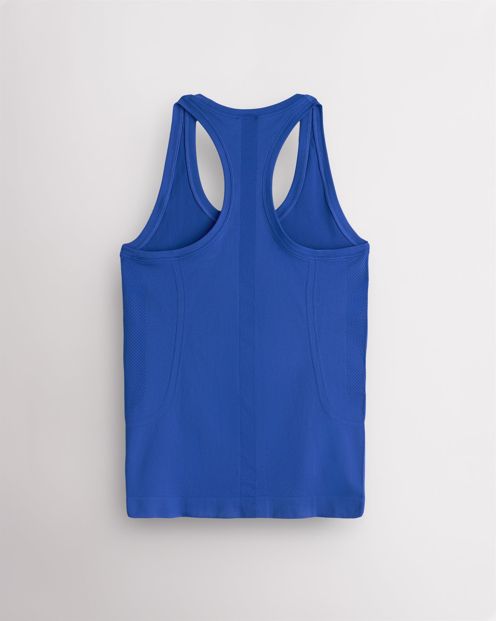 Back view of the Blue Wave Stelle seamless tank top, laid flat to show the racerback straps.