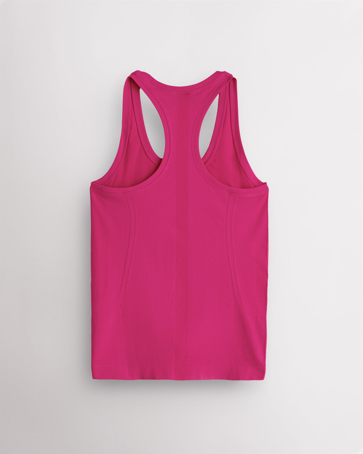 Back view of the Dreamhouse Pink Stelle seamless tank top, laid flat to show the racerback straps.