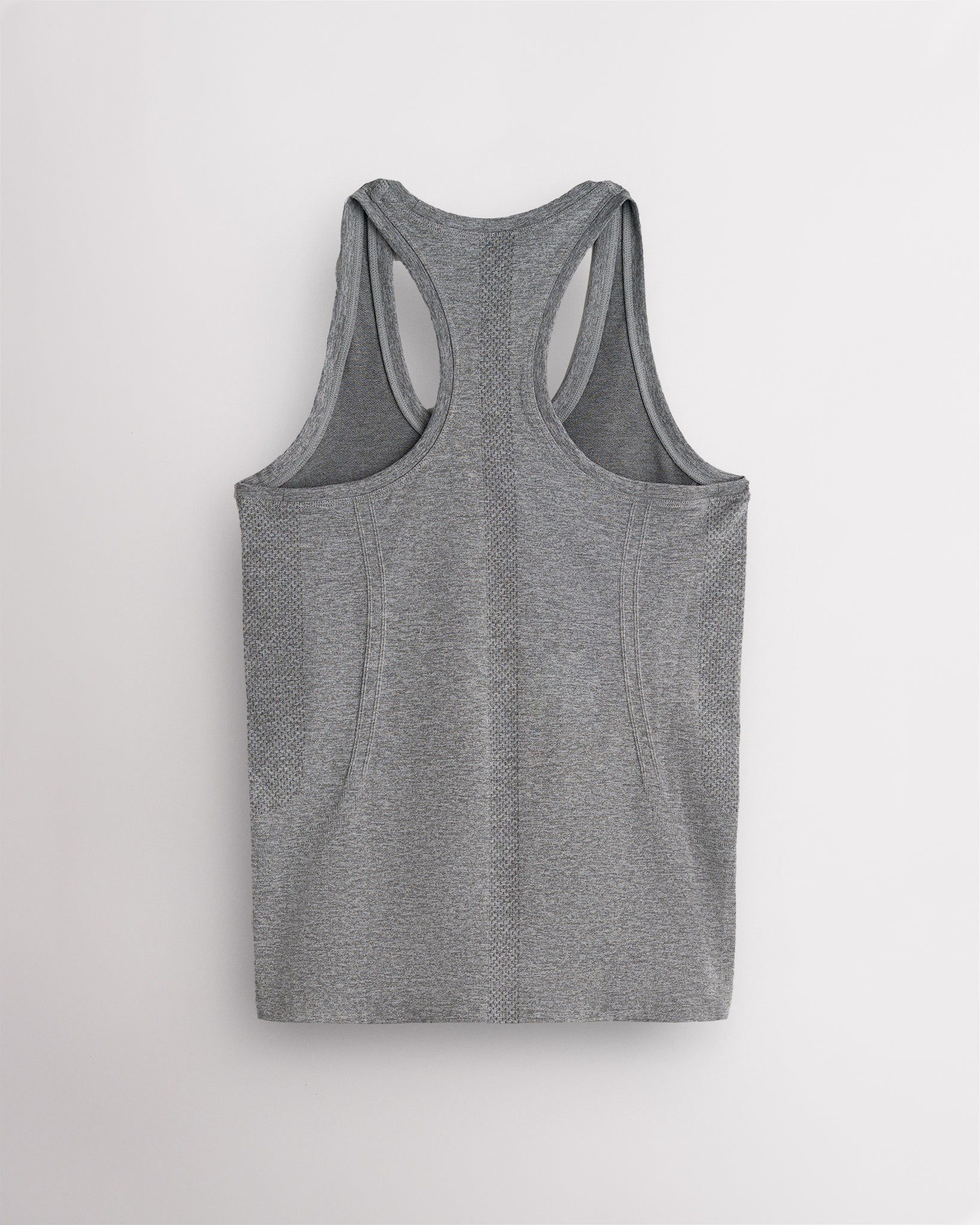 Back view of the grey Stelle seamless tank top, laid flat to show the racerback straps.